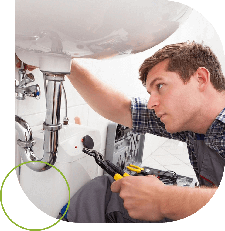 A man fixing the faucet of a sink.