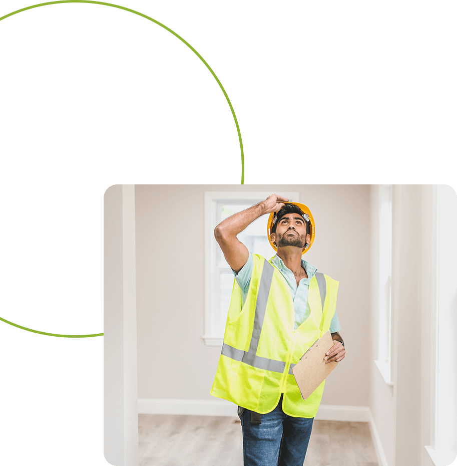 A man in an orange vest and hard hat.