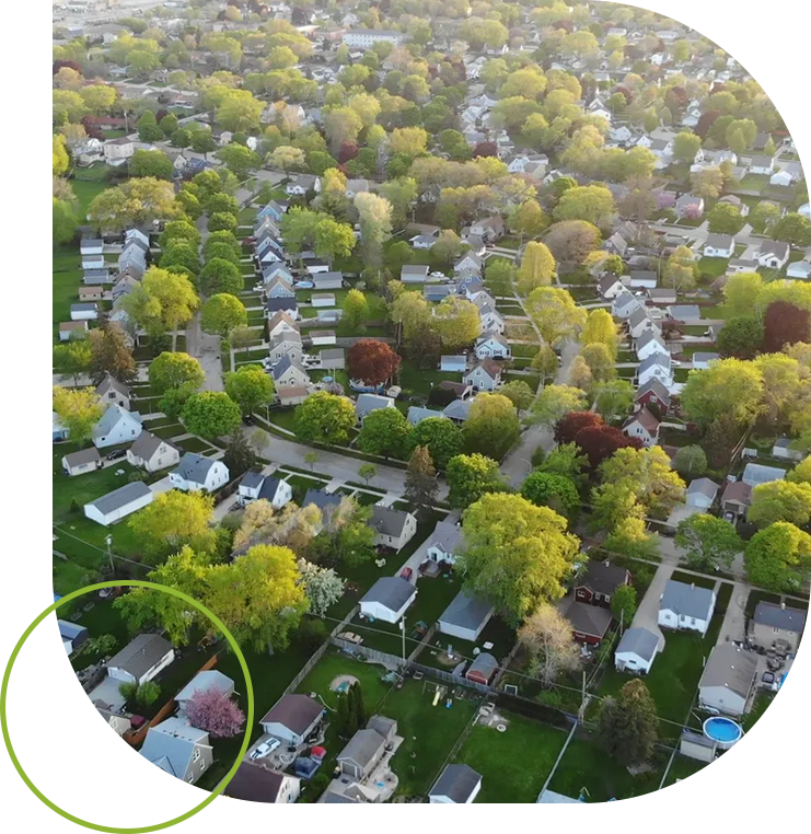 A bird 's eye view of houses and trees.