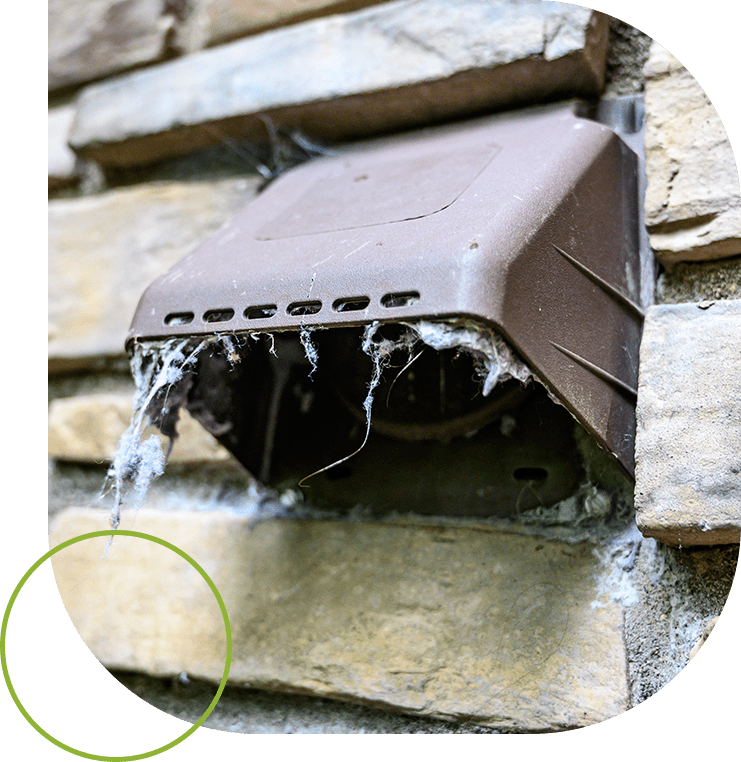 A brown vent on the side of a brick building.